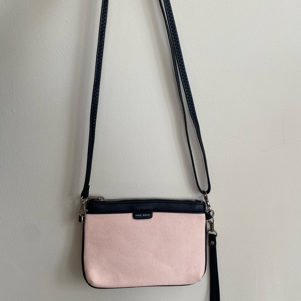 Blush colored convertible wristlet/crossbody bag